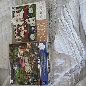 Two unopened puzzles puppies and camping